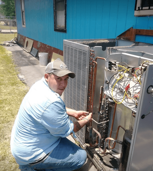 person installing ac unit