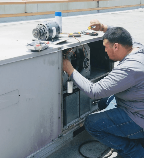 person installing ac unit